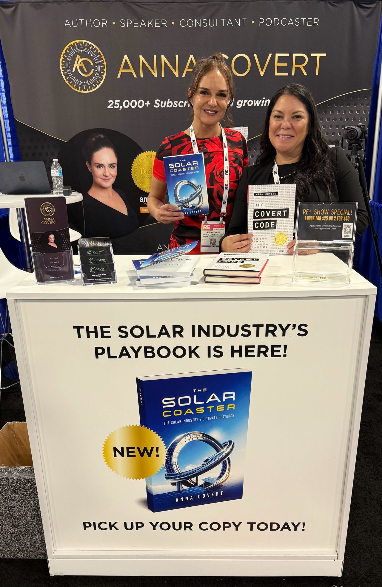 Anna Covert and Jocelyn Palafox at The Covert Code booth showcasing The Solar Coaster and The Covert Code books at RE+ Las Vegas 2025