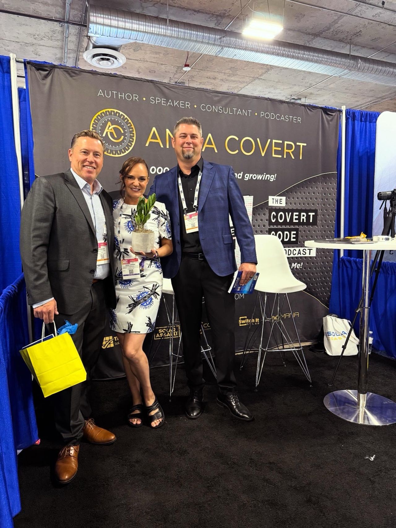 Anna Covert with Cobalt Power team members John Bergh and colleague at The Covert Code booth during RE+ Las Vegas 2025